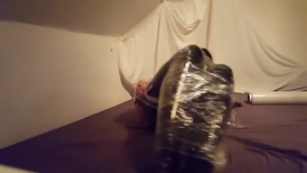 Sissy Gummipuppe In Folie - Sissy Slave In Plastic Wrap