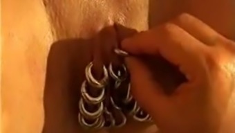 Heavily Pierced Milf Is Fisted