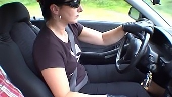 Amateur Brunette Smokes While Wearing Gloves In Car